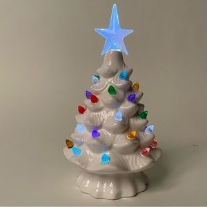 Small white ceramic Christmas tree with battery powered lights
